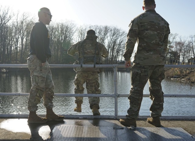 A blindfolded Pennsylvania National Guard Soldier leaps from the pier during the Combat Water Survival Test portion of the Ranger and Sapper Assessment Program at Fort Indiantown Gap, Pennsylvania, April 22, 2022. (U.S. Army photo by Sgt. 1st Class Matthew Keeler).
