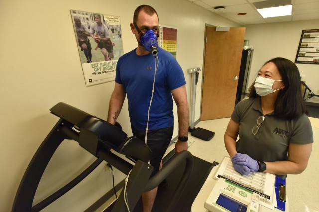 Mona Novakoski, an Army Wellness Center health educator, assists Staff Sgt. Benjamin Ashmead, from Headquarters and Headquarters Company, 14th Military Police Brigade, with what’s called a VO2 Max Test April 28 at the AWC. The test measures a person’s ability to perform sustained exercise. In January, when Ashmead decided he wanted to improve his fitness, he reached out to the AWC. He has been attending regular appointments there since January, and has dropped 10 pounds and reduced his percentage of body fat with their assistance. AWC services are open to all service members, retirees, Department of Defense civilians and dependents of active-duty service members. Call 573.596.9677 for details. 