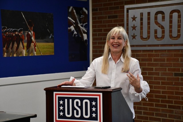 Executive Director for the USO National Capital District Lisa Marie Riggins gives opening remarks at the USO Honor Guard Lounge Gaming Center ribbon cutting April 22.