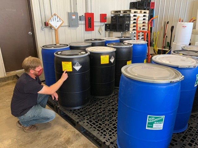 Jeremy Chamberlin, hazardous waste manager, checks the label on a container of waste in preparation for a shipment.  Fort Leonard Wood operates a 90-day accumulation area to safely hold hazardous wastes until it can be disposed of properly....