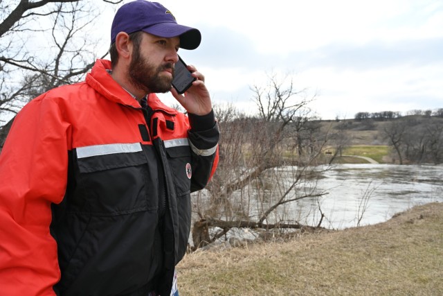 Adam Gamblin, U.S. Army Corps of Engineers, St. Paul District, geotechnical engineer, monitors a levee system within Valley City, North Dakota, April 28.  
Gamblin is among a team of engineers that are routinely looking at vulnerable areas within the community. They are positioned to rapidly respond to an area if a situation develops that needs to be addressed.
The U.S. Army Corps of Engineers, St. Paul District, and its contractor, Strata Corporation, from Grand Forks, North Dakota, completed around 8,000 linear feet of temporary levees to enhance protection within the community from the Sheyenne Rivers following recent weather events within the region. Corps officials completed the temporary levee construction April 26, ahead of the Sheyenne River cresting early next week. Corps officials are in coordination with their federal, state and local partners as the city monitors the levee system.  
