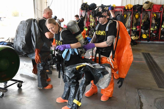 U.S. Army Capt. Russ Reed checks the protective equipment of Staff Sgt. Jerico Witte as members of the South Dakota National Guard’s 82nd Civil Support Team and the Rapid City Fire Department conduct annual hazardous material training in Rapid City, S.D., April 29, 2021.
