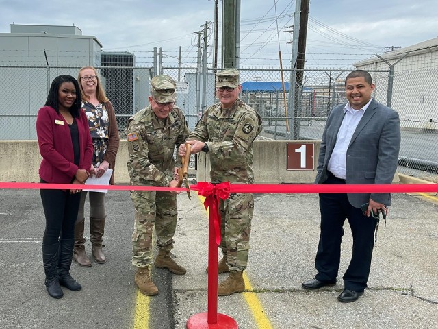 Brig. Gen. Tony McQueen, commanding general of US Army Medical Research and Development Command and Fort Detrick, is joined by Col. Dan Bryant, US Army Garrison Commander, and representatives of the Directorate of Family, Morale, Welfare and Recreation: Chico Medina, Shanise Swanson and Jennifer Aponte-Rivera, as they officially open the Auto Repair Lot, April 5, 2022.