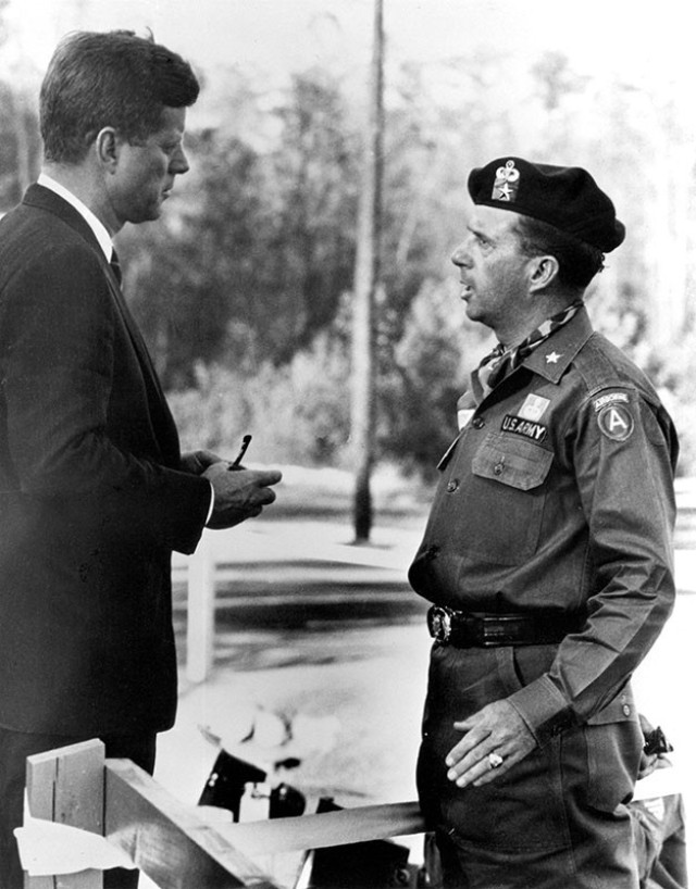 1 Brigadier General (BG) William P. Yarborough 
talked with President Kennedy following the 
12 October 1961 special warfare demonstration at McKellar’s Pond. The visit had been arranged by the president’s aide-de-camp, Major General (MG) Chester 
V. ‘Ted’ Clifton, a West Point ’36 classmate.




Brigadier General (BG) William P. Yarborough, the Commanding General, U.S. Army Special Warfare Center and School, Fort Bragg, NC, talked with President John F. Kennedy on 12 October 1961 at McKellar’s Pond following the Special Warfare demonstration. The visit had been arranged by the president’s aide-de-camp, Major General Chester V. ‘Ted’ Clifton, a West Point ’36 classmate.


SC594462          12OCT1961
President John F. Kennedy talks with Brig. Gen. William P. Yarborough, Comdt. of the Special Warfare Center.  Gem. Yarborough wears the green &#34;beret&#34;, distinctive headdres of the Special Forces.  The President is attending the Combat Readiness Demonstration held at Fort Bragg, NC.  Please credit &#34;John F. Kennedy P