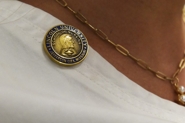 Each school of nursing has a unique pin they present to their graduates. The pin of the Lincoln University School of Nursing contains a profile of Abraham Lincoln – the university’s namesake – along with a lamp superimposed upon an opened book. The opened book represents nursing’s continuing quest for knowledge; the lamp symbolizes Florence Nightingale, the founder of professional nursing. 