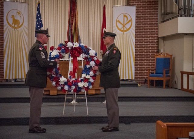 U.S. Army Engineer School Regimental Command Sgt. Maj. John Brennan (left), and Col. Daniel Hibner, USAES commandant, place a wreath in remembrance of fallen engineers during the Fallen Sapper Memorial April 28 at Soldier Memorial Chapel. 