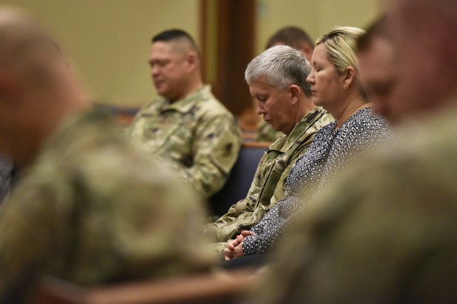 Maj. Gen. James Bonner, Maneuver Support Center of Excellence and Fort Leonard Wood commanding general, prays alongside his wife, Debra, this morning during the National Day of Prayer event at the Main Post Chapel. The 30-minute event provided an opportunity for religious community leaders from Christian-, Jewish- and Buddhist-based faiths to offer prayers for the nation, its elected leaders, military leaders, the military, military families, peace and the community. 