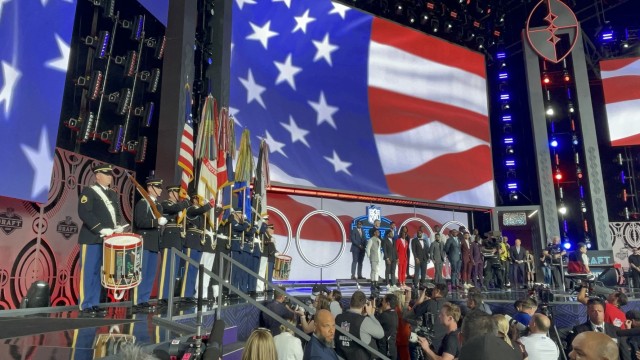 A Joint Armed Forces Color Guard and drummers from The U.S. Army Old Guard Fife and Drum Corps present the colors at the NFL Draft, April 28, 2022. 