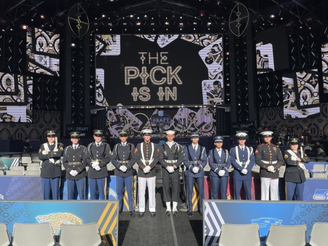 A Joint Armed Forces Color Guard and drummers from The U.S. Army Old Guard Fife and Drum Corps present the colors at the NFL Draft, April 28, 2022. 
