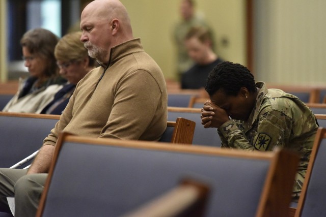 Service members and civilians of various faiths gathered this morning at the Main Post Chapel to pray for the community, the nation, its leaders and the armed forces during the National Day of Prayer event. 