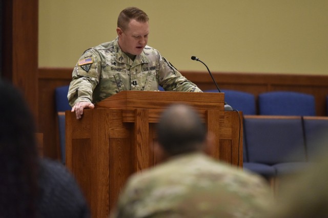 Chaplain (Captain) Joshua Sharp, of the 787th Military Police Battalion and the chaplain of the Latter-day Saint Community of Service, says a prayer for military leaders during the National Day of Prayer event this morning at the main post chapel.  During the 30-minute event, leaders of religious communities of Christian, Jewish and Buddhist faiths offered prayers for the nation, its elected leaders, military leaders, service members, military families, peace and community. 