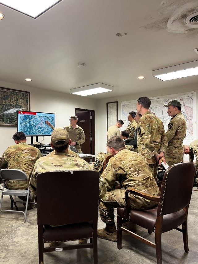 1st Lt. Ellis Johnson from 2nd Squadron, 17th Cavalry Regiment, 101st Combat Aviation Brigade, 101st Airborne Division (Air Assault), conducts an Operations and Intelligence brief during Operation Lethal Eagle II with the crew members from Bravo Co., 4-2 Attack Battalion, 2 Combat Aviation Brigade, 2nd Infantry Division on 24 April, 2022 on range 28, Fort Campbell, Ky., before conducting their aerial gunnery qualifications.