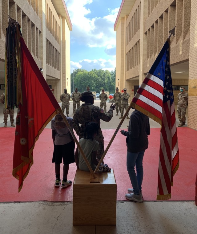 Drill sergeant Alicia King with her children at her promotion ceremony