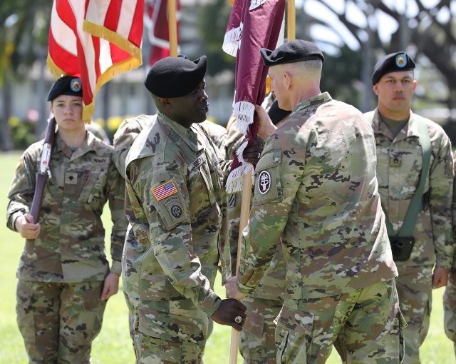 Command Sgt. Maj. Fergus J. Joseph passes the colors of Regional Health Command-Pacific to Brig. Gen. Edward H. Bailey during Joseph&#39;s assumption of responsibility as the new command sergeant major of RHC-P, Fort Shafter, Hawaii, May 9, 2022.