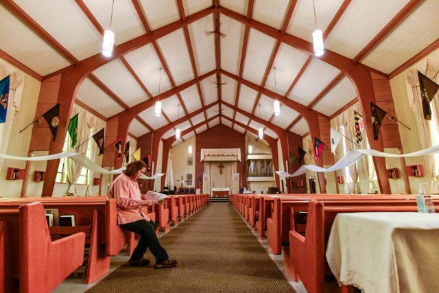 Stephanie Nutt, an archaeologist with the Fort Leonard Wood Cultural Resources Program, reviews the building and context evaluation document for Soldier Memorial Chapel on Fort Leonard Wood. Built in the Modern architectural style in 1962, the...