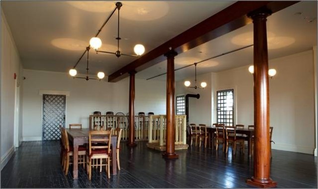 Grant Hall&#39;s third floor courtroom, restored to the way it appeared during the Lincoln assassination conspirators’ trial of 1865, features bars on the windows and door and the prisoners’ docket, recreated based on artistic renderings and written descriptions of court proceedings.