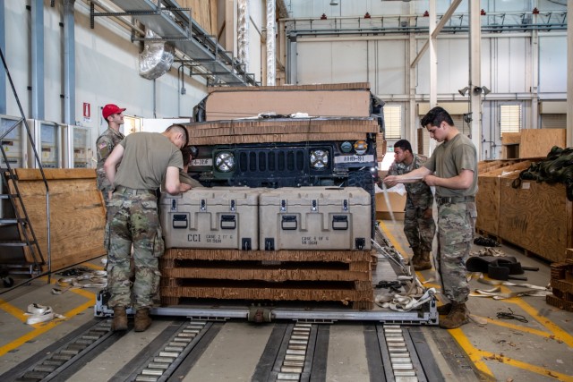 173rd Airborne Soldiers prepare equipment for drop