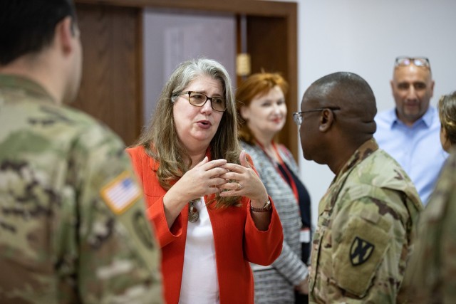 Deputy Chief of Mission Andrea Brouillette-Rodriguez, U.S. Embassy in Sofia, talks with U.S. Army Col. Kendrick Traylor, commander of Area Support Group - Black Sea, on the importance of building relationships and civil-military cooperation during a ceremony for the combined Bulgarian Red Cross training between U.S. Army Soldiers assigned to the 407th Civil Affairs Battalion and Bulgarian Land Forces soldiers assigned to the Civil-Military Cooperation Company, 78th Support Battalion at Lozen, Bulgaria, May 11, 2022. The coordination between U.S. Army Civil Affairs, Bulgarian Civil-Military Cooperation, and local civilian organizations is crucial in supporting humanitarian assistance and disaster relief in the region, and is necessary to protect and promote humanitarian principles. Bulgaria is a steadfast and gracious host, and the U.S. is honored to continue its long-term cooperation through engagements such as bilateral exchanges to improve partnership interoperability. (U.S. Army photo by Capt. Angelo Mejia, 5th Mobile Public Affairs Detachment)
