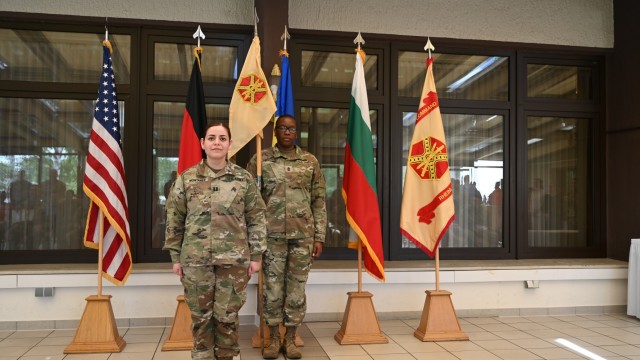 The new Headquarters, Headquarters Company commander Capt. Gabriela Montanez stands with HHC 1st Sgt.  