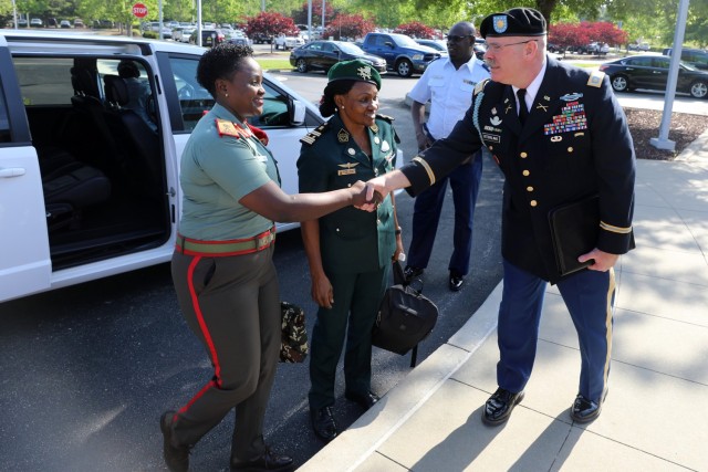 Maj. Mike Sterling, North Carolina National Guard State Partnership director, greets Namibian Defence Force Brig. Gen. Helena Ndilimeke Amutenya, left, and Cameroon Armed Forces Col. Marguerite Meffand-Loaw, center, at the African Military Law Forum Advisory Council at NCNG Joint Force Headquarters in Raleigh, North Carolina, April 26-28, 2022. The conference, created by U.S. Africa Command, brought African military legal advisers from several nations including Botswana, one of the NCNG State Partnership Program peers, and NCNG leaders to share their legal expertise.