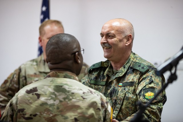Maj. Gen. Mihail Dimitrov Popov, commander of the Bulgarian Land Forces, talks with U.S. Army Col. Kendrick Traylor, commander of Area Support Group - Black Sea, during a ceremony for the combined Bulgarian Red Cross training between U.S. Army Soldiers assigned to the 407th Civil Affairs Battalion and Bulgarian Land Forces soldiers assigned to the Civil-Military Cooperation Company, 78th Support Battalion at Lozen, Bulgaria, May 11, 2022. The coordination between U.S. Army Civil Affairs, Bulgarian Civil-Military Cooperation, and local civilian organizations is crucial in supporting humanitarian assistance and disaster relief in the region, and is necessary to protect and promote humanitarian principles. Bulgaria is a steadfast and gracious host, and the U.S. is honored to continue its long-term cooperation through engagements such as bilateral exchanges to improve partnership interoperability. (U.S. Army photo by Capt. Angelo Mejia, 5th Mobile Public Affairs Detachment)