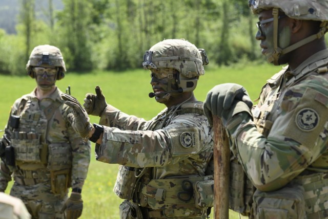 U.S. Army Capt. Edgar Orellana, center, troop commander of Lightning Troop, 3rd Squadron, 2nd Cavalry Regiment talks to his men in an after action review after a squad live fire exercise at the 7th Army Training Command’s Grafenwoehr Training Area, Germany, May 12, 2022. The ability to effectively communication is one among several key Knowledge, Skills, and Behaviors (KSB) the Army looks for in its Leaders.