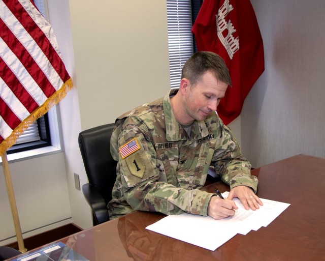 Col. Travis Rayfield, commander, Kansas City District signs agreement