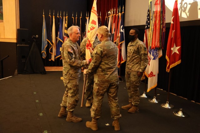 Col. Alicia M. Masson passes the U.S. Army Environmental Command colors to the Commanding General of Installation Management Command, as a symbol of relinquishing command.