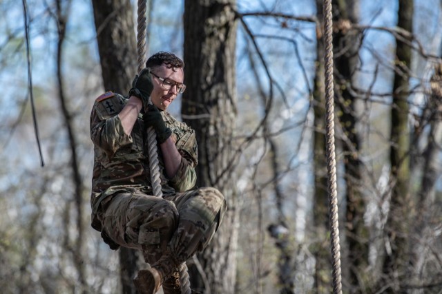 Sgt. Josiah Bell of Rochester, Minnesota, an infantryman with the Wisconsin National Guard’s B Company, 1st Battalion, 128th Infantry Regiment, scales a rope in the obstacle course event during the Region IV Best Warrior Competition at Camp Ripley, Minnesota, May 13, 2022. The annual competition tests the military skills, strength and endurance of the top Soldiers and noncommissioned officers from the Minnesota, Wisconsin, Iowa, Illinois, Michigan, Indianaand Ohio National Guard. (Minnesota National Guard photo by Staff Sgt. Sydney Mariette.) 