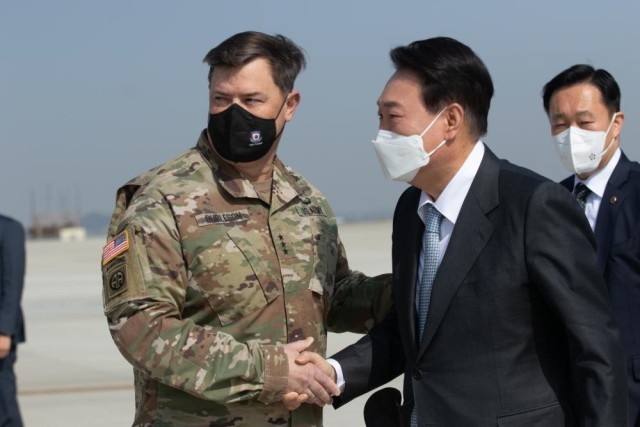 Lt. Gen. Willard Burleson (left), the Combined Forces command chief of staff and commander of Eighth Army, greets South Korea&#39;s president elect, Yoon Suk-yeol, at Desiderio Arifield on Camp Humphreys, South Korea on Apr. 7, 2022. 