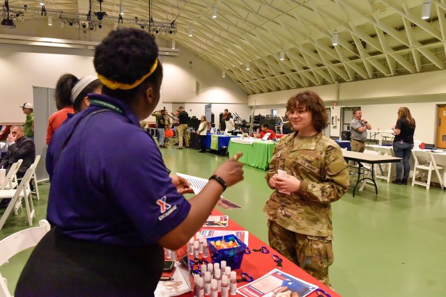 Pvt. Evelynn Francis, Company F, 3rd Battalion, 10th Infantry Regiment, discusses future career options with Army and Air Force Exchange Service recruiters during a career summit organized by the Fort Leonard Wood Transition Assistance Program May 12 at Nutter Field House. Eighty-two vendors participated with more than 70,000 available positions. 