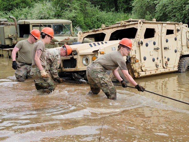 Soldiers with the Active, Reserve and Army National Guard components attend a vehicle recovery course at Fort Custer Training Center, Augusta, Michigan, May 19, 2022.  (U.S. Air National Guard photo by Master Sgt. David Eichaker)