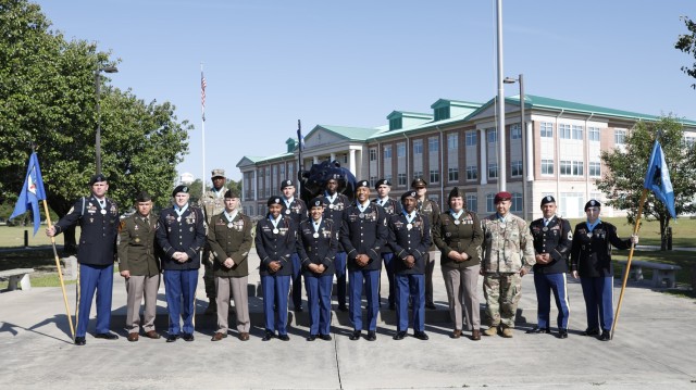 Soldiers from the 3rd Infantry Division pose for a group photo during a Sergeant Audie Murphy Club induction ceremony at Fort Stewart, Georgia, May 17, 2022. This is the first SAMC  induction ceremony the 3rd ID has hosted since the start of the COVID-19 pandemic. Being inducted into SAMC indicates that a noncommissioned officer has demonstrated the highest standards of excellence. (U.S. Army photo by Sgt. Aaliyah Craven, 50th Public Affairs Detachment)