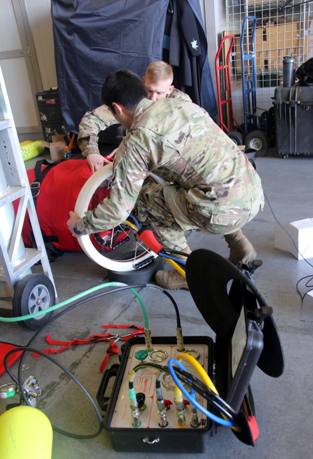 Army medics assigned to units at Joint Base Lewis-McChord, Washington, train on a portable hyperbaric chamber during the Joint Hyperbaric Medical Officer and Technician Course, April 26, 2022. 