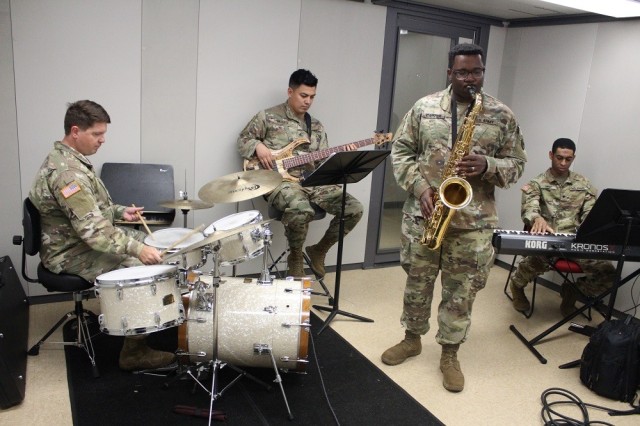 The jazz combo includes, from left, Sgt. 1st Class Zack Miller, on drums; Sgt. Raul Uriarte, on bass guitar; Sgt. Kevin Carter, jazz combo leader, on saxophone; and Spc. Ju’Nias Smoot, on keyboard. 