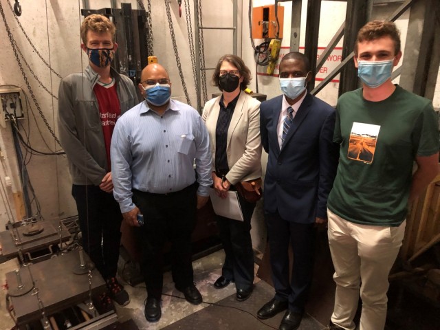 (Left to right) Matthew Hoare, Reuben Govender, Hollie Pietsch, Mamadou Diallo and Pierre Van der Merwe visited the University of Cape Town as part of the academic tour of the UC research facilities. They are standing in a blast chamber used to test the impact of explosive detonations.