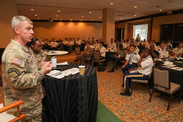 Command Sgt. Maj. Robert Haynie, left, senior enlisted leader for the 25th Infantry Division, speaks about Army talent management during a leadership solarium at the Land Forces Pacific Symposium in Honolulu, May 19, 2022. Nearly 100 U.S. Army and foreign junior leaders participated in the solarium to learn more about building trust in their units, strategic thinking and talent management.