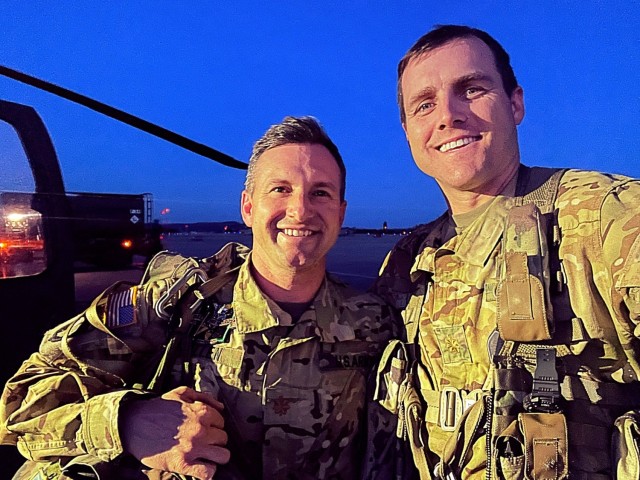 Maj. Chaz Allen (left) and Maj. Kurt Hunt (right) complete a ceremonial flight signifying Hunt&#39;s passing of the torch to Allen as the executive officer for 1st Air Cavalry Brigade. (U.S. Army photo by Maj. Kurt Hunt)