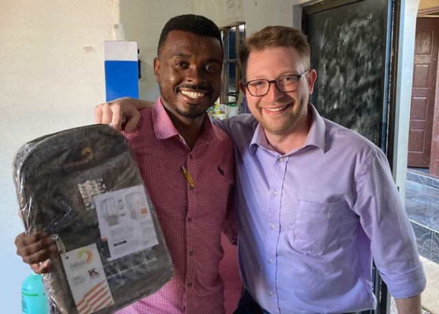 (Left) Kedumentse &#34;Ched&#34; Liphi, a 31-year-old entrepreneur and Botswana Defense Force veteran, designed and manufactures backpacks for school children with a solar panel, small battery and light. He met with Dr. Patrick Fowler, DEVCOM...