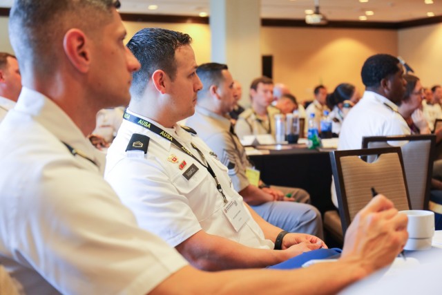 Sgt. 1st Class Edilberto Ramos, second from left, who is assigned to the 78th Signal Battalion, listens to a panel on Army talent management during a leadership solarium at the Land Forces Pacific Symposium in Honolulu, May 19, 2022. Nearly 100 U.S. Army and foreign junior leaders participated in the solarium to learn more about building trust in their units, strategic thinking and talent management.