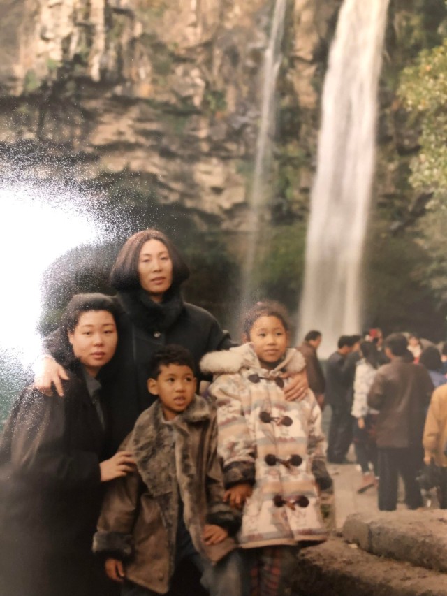 Sgt. Ester White, right, with her mother and siblings in at Cheonjiyeon Waterfall in JeJu Island in 1995.