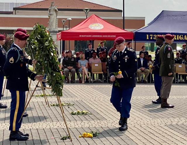 Paratroopers, their dress uniform bloused into shiny jump boots, stepped forward a presented a single yellow rose for each of the 91 Soldiers from the brigade killed in Iraq and Afghanistan.