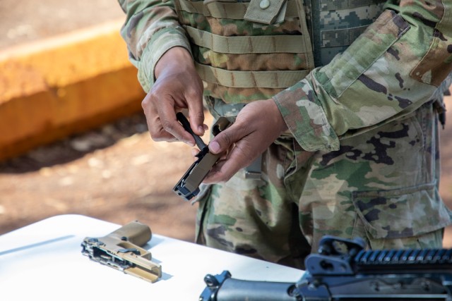 Pvt. Williams field-strips the M17 handgun