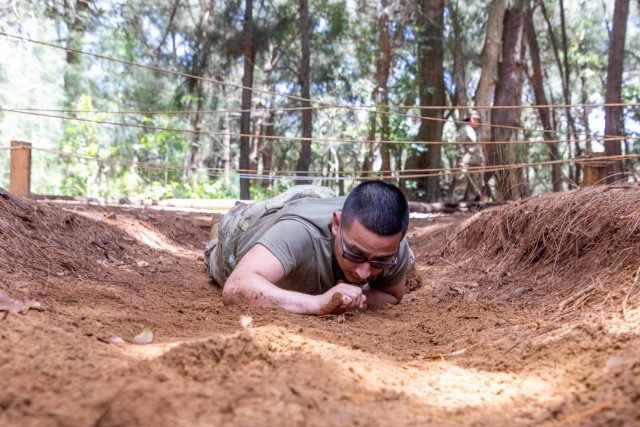 Pvt. Martinez completes the low crawl obstacle
