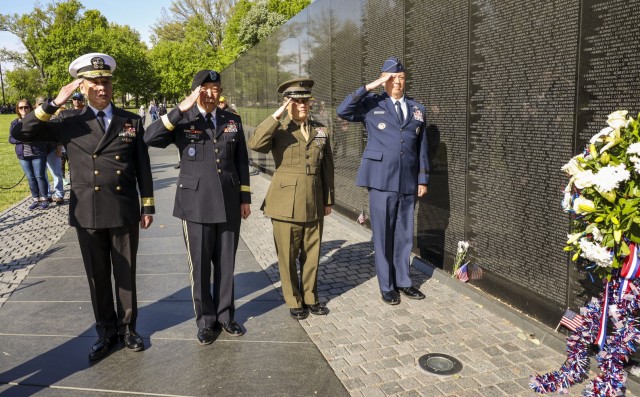 U.S. service members of Vietnamese descent, including four flag and general officers, pay tribute to veterans of the Vietnam War at the Vietnam War Memorial in Washington, D.C., April 30, 2022. The wreath laying ceremony falls on the anniversary of Operation Frequent Wind, which evacuated Americans and South Vietnamese during the fall of Saigon at the conclusion of the Vietnam War in 1975.