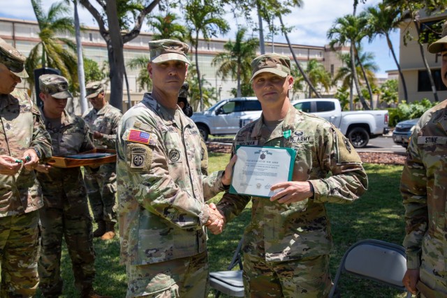 Brig. Gen. Holler presents 2nd. Lt. Holzman with an Army Commendation Model