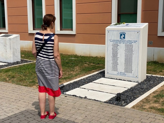 A community member at U.S. Army Garrison Italy pays respects at the newly unveiled monument to the Sky Soldiers at Caserma Del Din. The granite stone – first unveiled at Forward Operating Base Fenty, in Jalalabad – was recovered in 2020 by 10th Mountain Division troops, who sent it from Afghanistan to Fort Drum, New York. In August 2021, they sent it to U.S. Army Garrison Italy