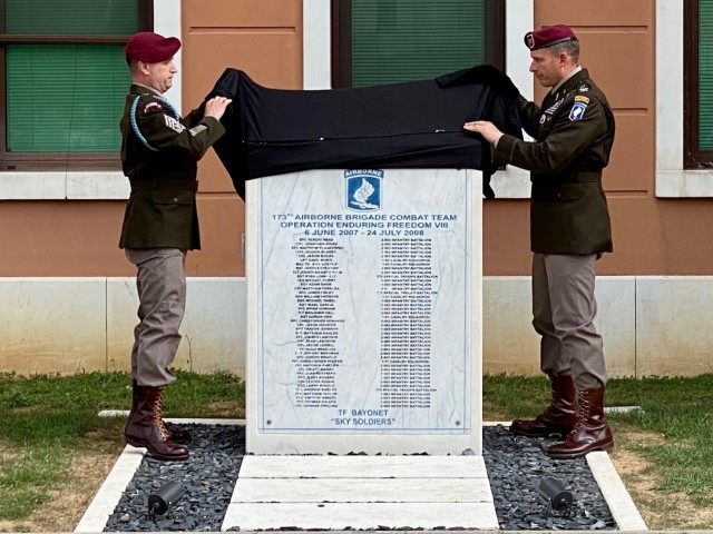 During the remembrance ceremony, held just ahead of the Memorial Day weekend, Col. Michael Kloepper, right, and Command Sgt. Maj. Christopher Chapin, the command team for the 173rd, unveiled a memorial stone from Afghanistan at Caserma Del Din.