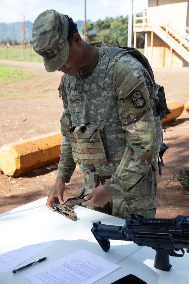 Pvt. Williams field-strips the M17 handgun