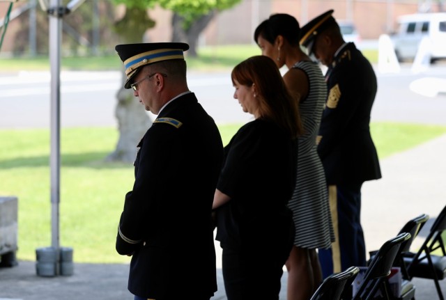 Community members pause for a moment of prayer during the U.S. Army Japan Memorial Day ceremony on May 30, 2022, at Camp Zama, Japan.
